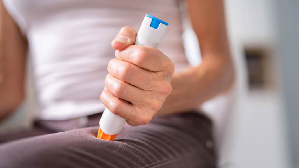 EpiPen being held